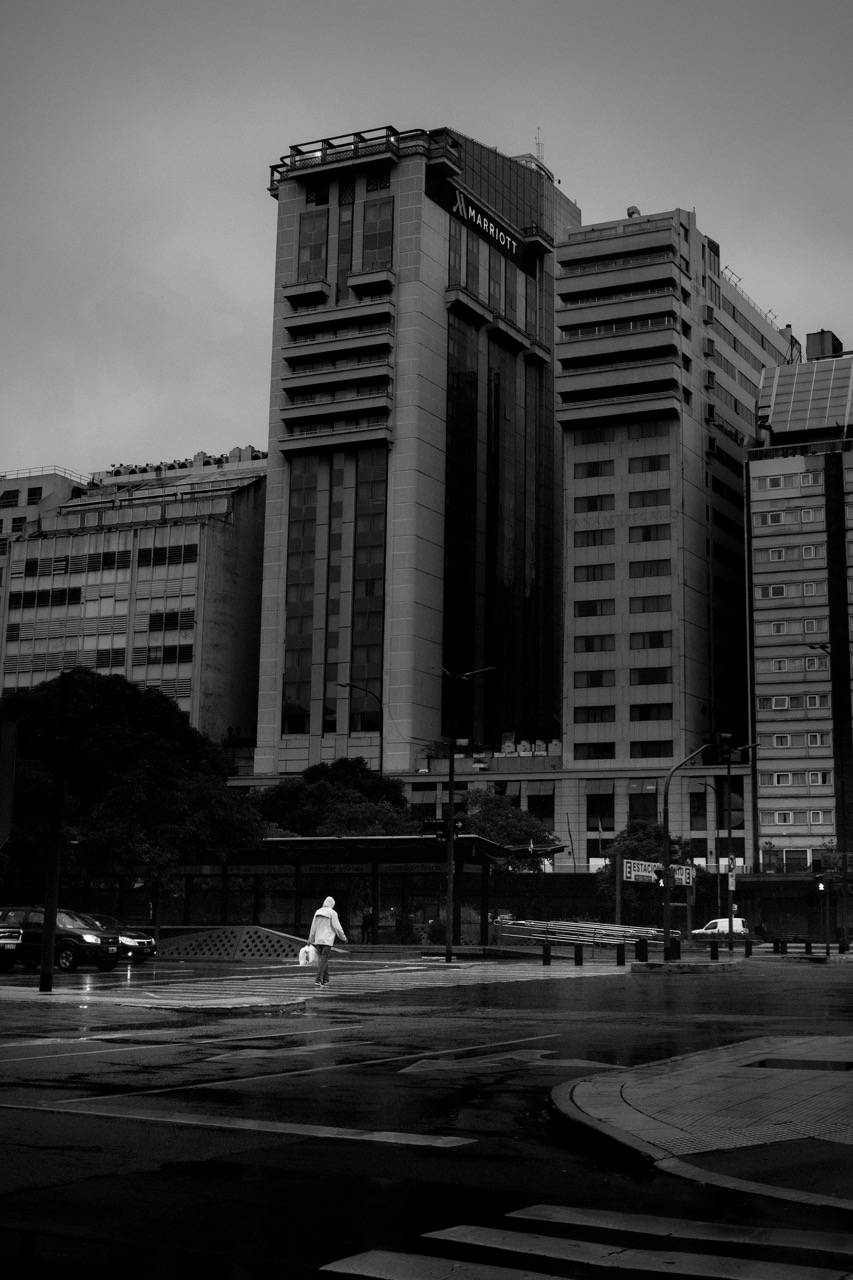 Soledad — figure in a vast modern plaza